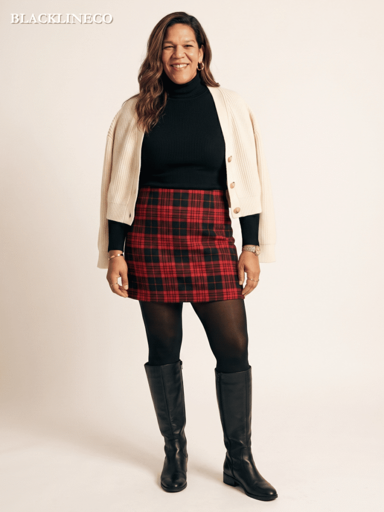 Plus size woman wearing a plaid mini skirt with a fitted turtleneck