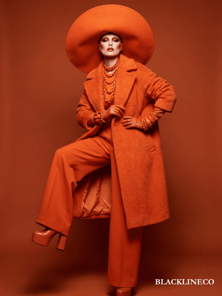 Woman wearing a bold monochrome orange outfit, an overdone fall fashion trend example
