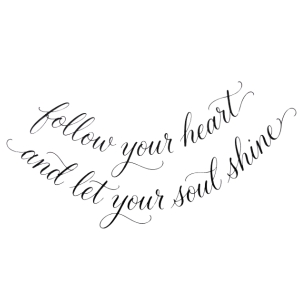 Cursive script quote tattoo design curved along the hip bone