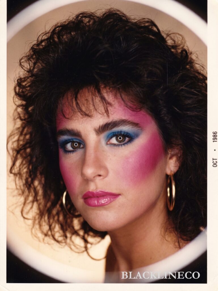 80s Hair and Makeup Trends 80s hair and makeup style with permed hair and bold eyeshadow